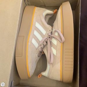 Adidas women’s orange and tan super sleek 72 shoes.